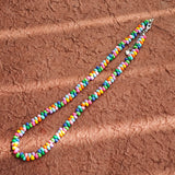 This is a bead necklace that consists of colorful peanut shape beads. It's as colorful as rainbow.