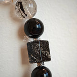 This is a crystal bracelet consists of Black Gold Ultra-Sparkle Azeztulite, Herkimer Diamond, Lace Black Rutilated Quartz, Obsidian and Tea Citrine Running Ring.