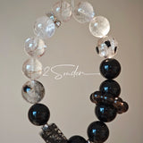 This is a crystal bracelet consists of Black Gold Ultra-Sparkle Azeztulite, Herkimer Diamond, Lace Black Rutilated Quartz, Obsidian and Tea Citrine Running Ring.