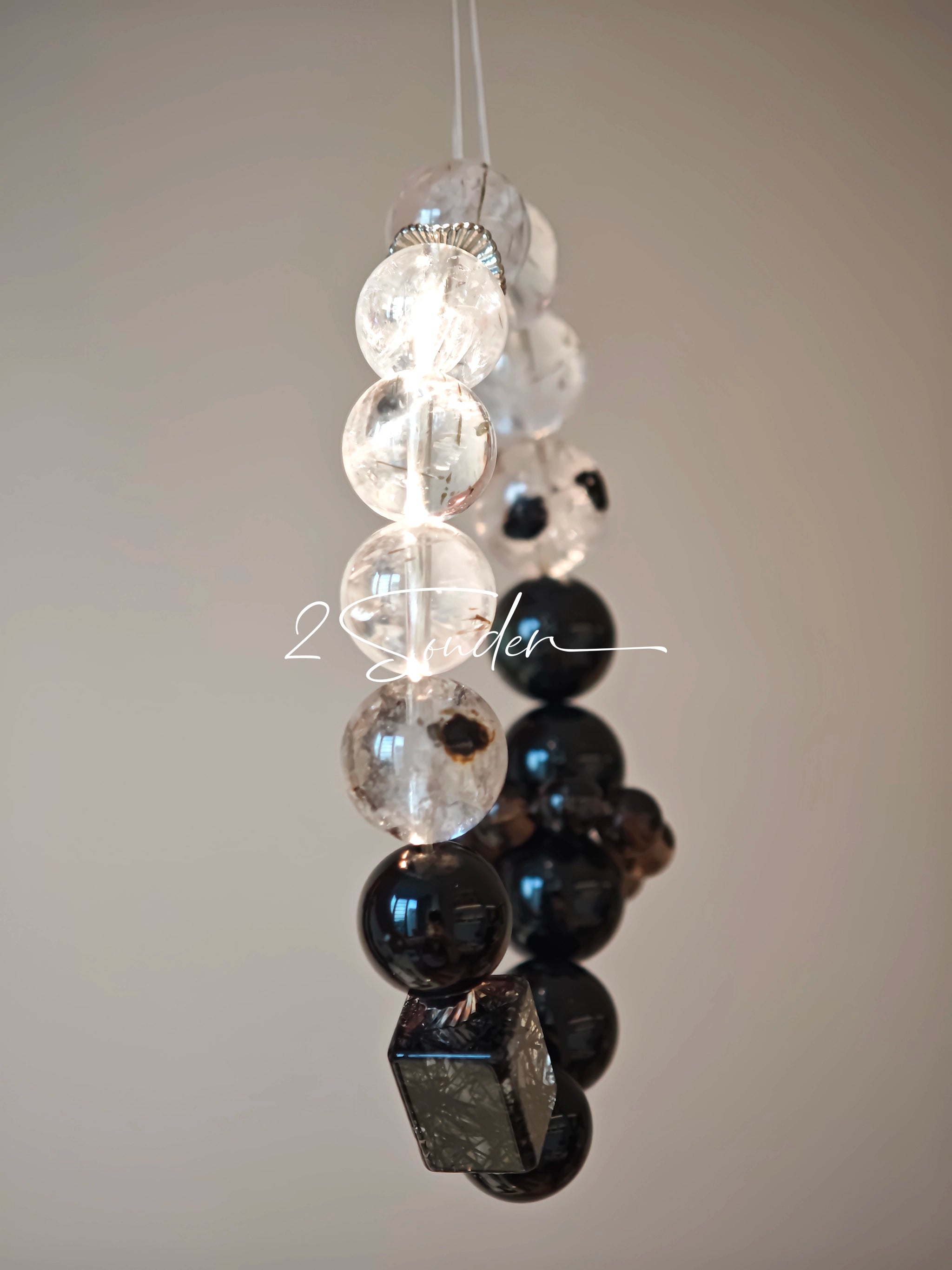 This is a crystal bracelet consists of Black Gold Ultra-Sparkle Azeztulite, Herkimer Diamond, Lace Black Rutilated Quartz, Obsidian and Tea Citrine Running Ring.