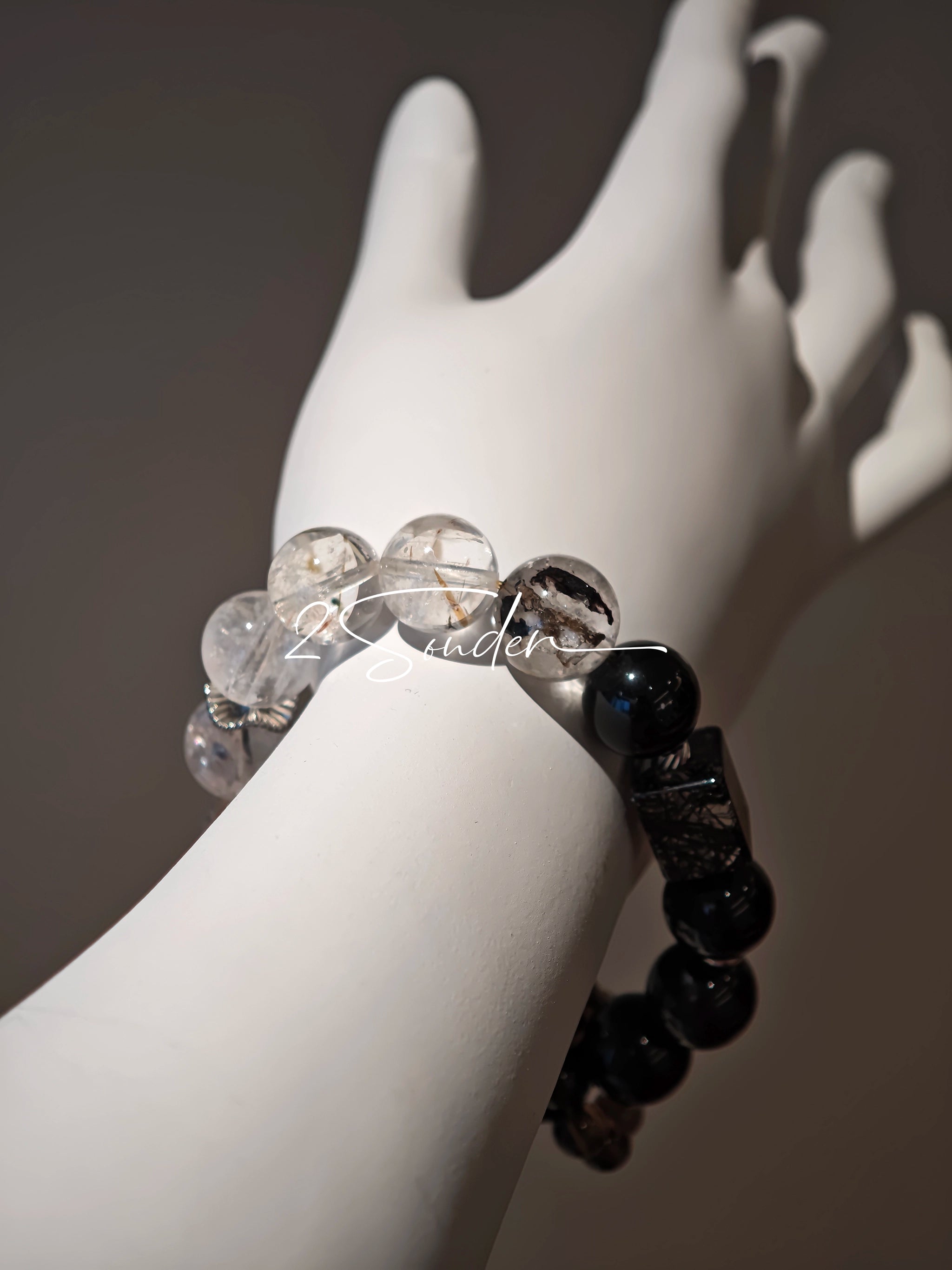 This is a crystal bracelet consists of Black Gold Ultra-Sparkle Azeztulite, Herkimer Diamond, Lace Black Rutilated Quartz, Obsidian and Tea Citrine Running Ring.