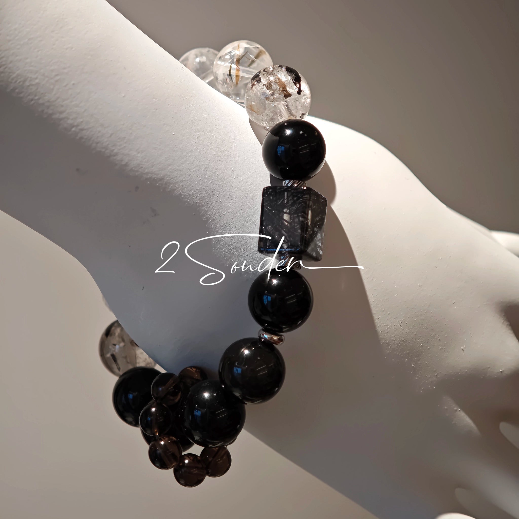 This is a crystal bracelet consists of Black Gold Ultra-Sparkle Azeztulite, Herkimer Diamond, Lace Black Rutilated Quartz, Obsidian and Tea Citrine Running Ring.