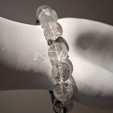 This is a crystal bracelet consists of Black Gold Ultra-Sparkle Azeztulite, Herkimer Diamond, Lace Black Rutilated Quartz, Obsidian and Tea Citrine Running Ring.