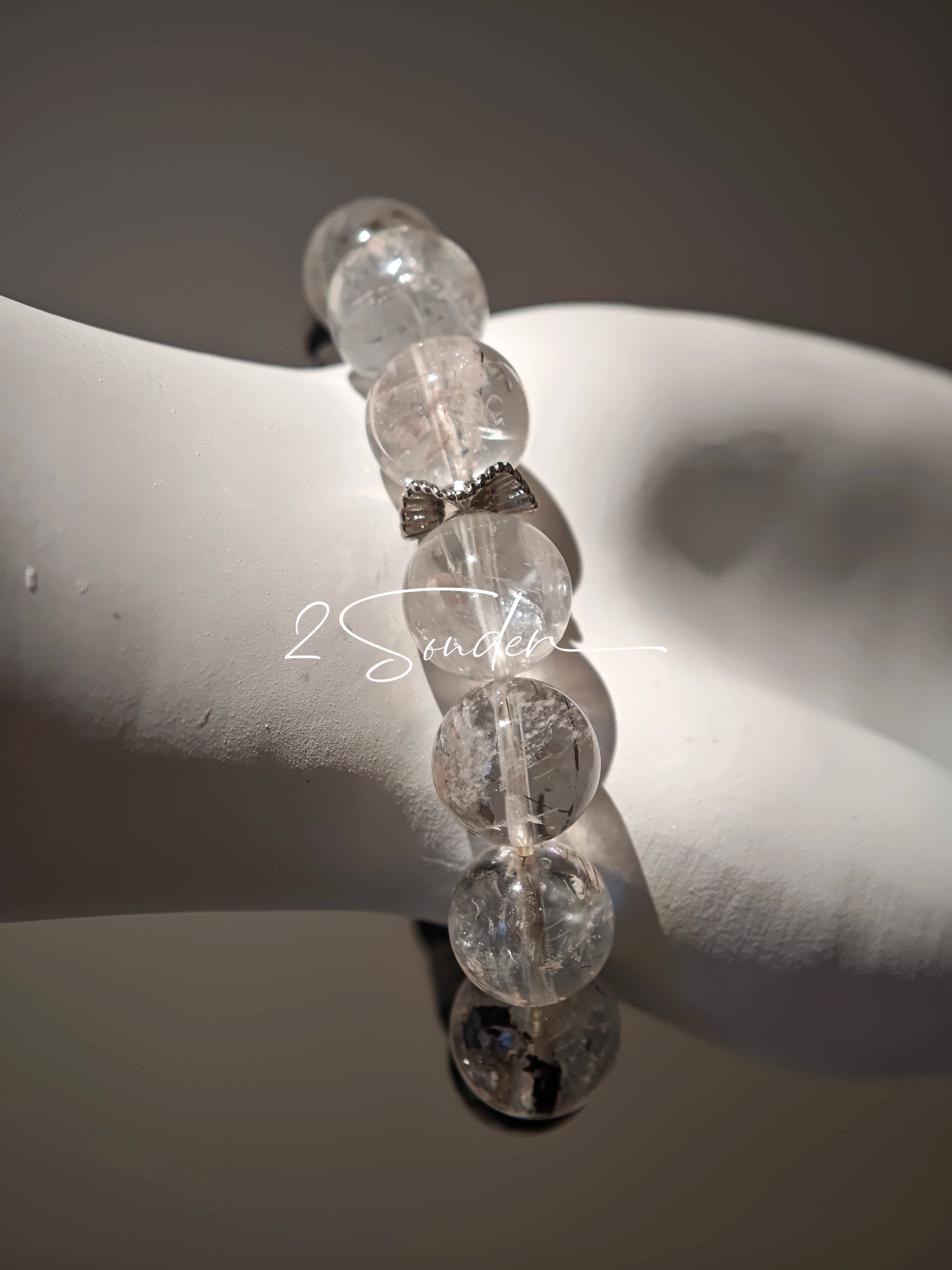 This is a crystal bracelet consists of Black Gold Ultra-Sparkle Azeztulite, Herkimer Diamond, Lace Black Rutilated Quartz, Obsidian and Tea Citrine Running Ring.