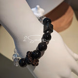This is a crystal bracelet consists of Black Gold Ultra-Sparkle Azeztulite, Herkimer Diamond, Lace Black Rutilated Quartz, Obsidian and Tea Citrine Running Ring.