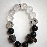 This is a crystal bracelet consists of Black Gold Ultra-Sparkle Azeztulite, Herkimer Diamond, Lace Black Rutilated Quartz, Obsidian and Tea Citrine Running Ring.