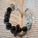 This is a crystal bracelet consists of Black Gold Ultra-Sparkle Azeztulite, Herkimer Diamond, Lace Black Rutilated Quartz, Obsidian and Tea Citrine Running Ring.