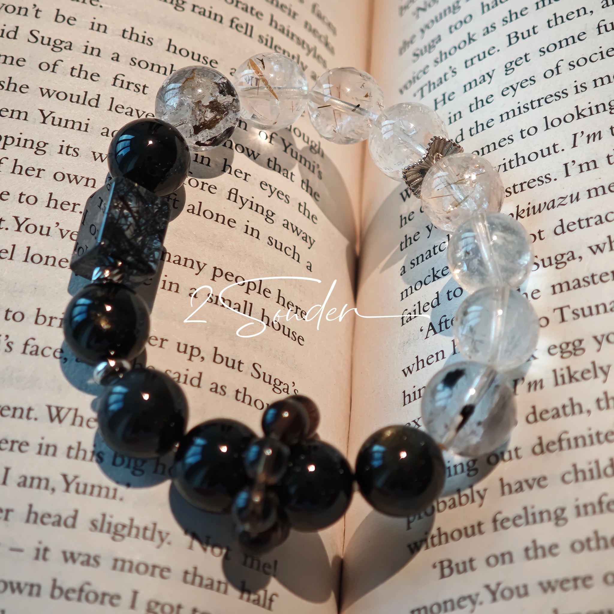 This is a crystal bracelet consists of Black Gold Ultra-Sparkle Azeztulite, Herkimer Diamond, Lace Black Rutilated Quartz, Obsidian and Tea Citrine Running Ring.