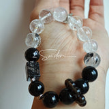 This is a crystal bracelet consists of Black Gold Ultra-Sparkle Azeztulite, Herkimer Diamond, Lace Black Rutilated Quartz, Obsidian and Tea Citrine Running Ring.