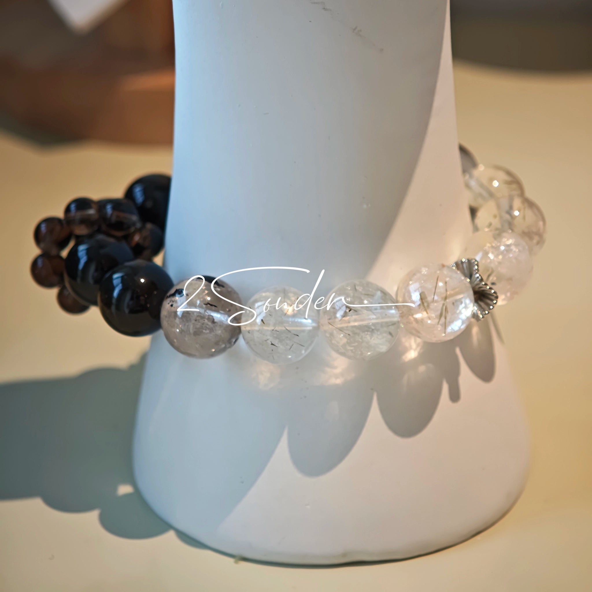 This is a crystal bracelet consists of Black Gold Ultra-Sparkle Azeztulite, Herkimer Diamond, Lace Black Rutilated Quartz, Obsidian and Tea Citrine Running Ring.