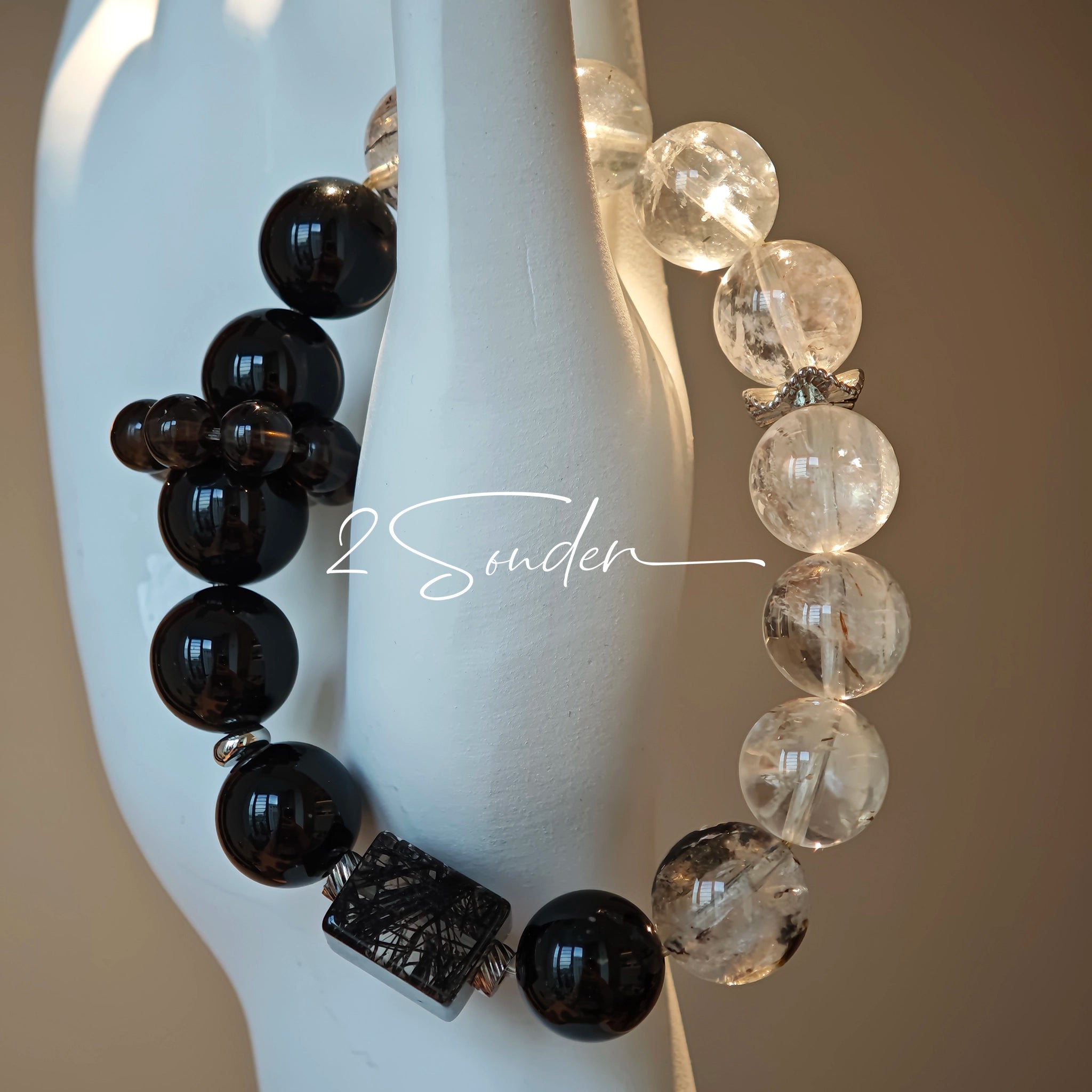This is a crystal bracelet consists of Black Gold Ultra-Sparkle Azeztulite, Herkimer Diamond, Lace Black Rutilated Quartz, Obsidian and Tea Citrine Running Ring.