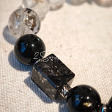 This is a crystal bracelet consists of Black Gold Ultra-Sparkle Azeztulite, Herkimer Diamond, Lace Black Rutilated Quartz, Obsidian and Tea Citrine Running Ring.