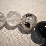 This is a crystal bracelet consists of Black Gold Ultra-Sparkle Azeztulite, Herkimer Diamond, Lace Black Rutilated Quartz, Obsidian and Tea Citrine Running Ring.