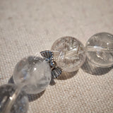 This is a crystal bracelet consists of Black Gold Ultra-Sparkle Azeztulite, Herkimer Diamond, Lace Black Rutilated Quartz, Obsidian and Tea Citrine Running Ring.