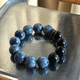 This is a bracelet consists of Blue Denim Pietersite and Golden Sheen Obsidian. The color of the bracelet is denim blue and black, accented by sleek silver spacer.