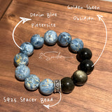 This is a bracelet consists of Blue Denim Pietersite and Golden Sheen Obsidian. The color of the bracelet is denim blue and black, accented by sleek silver spacer.