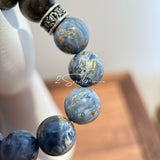 This is a bracelet consists of Blue Denim Pietersite and Golden Sheen Obsidian. The color of the bracelet is denim blue and black, accented by sleek silver spacer.