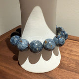 This is a bracelet consists of Blue Denim Pietersite and Golden Sheen Obsidian. The color of the bracelet is denim blue and black, accented by sleek silver spacer.