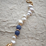 This is a bracelet crafted with S925 silver, blue aventurine, zircon, and pearls. It blends French and Chinese aesthetics and will bring elegance and good fortune.