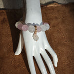 Wrapped around you: Rose Quartz love, White Phantom Quartz clarity, and an agate rabbit guardian.