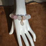 Wrapped around you: Rose Quartz love, White Phantom Quartz clarity, and an agate rabbit guardian.