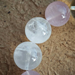 This crystal strand showcases Rose Quartz, White Phantom Quartz, and an agate rabbit bead.