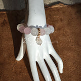 This natural crystal bracelet features a serene mix of white phantom quartz, soft rose quartz, and luminous citrine beads, creating a light, airy aesthetic. Adorned with delicate star-and-moon bodhi seed accents and a milky white chalcedony pendant, it adds a touch of gentle elegance to everyday wear.