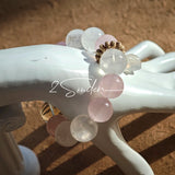 This natural crystal bracelet features a serene mix of white phantom quartz, soft rose quartz, and luminous citrine beads, creating a light, airy aesthetic. Adorned with delicate star-and-moon bodhi seed accents and a milky white chalcedony pendant, it adds a touch of gentle elegance to everyday wear.