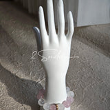 This natural crystal bracelet features a serene mix of white phantom quartz, soft rose quartz, and luminous citrine beads, creating a light, airy aesthetic. Adorned with delicate star-and-moon bodhi seed accents and a milky white chalcedony pendant, it adds a touch of gentle elegance to everyday wear.