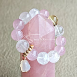 This natural crystal bracelet features a serene mix of white phantom quartz, soft rose quartz, and luminous citrine beads, creating a light, airy aesthetic. Adorned with delicate star-and-moon bodhi seed accents and a milky white chalcedony pendant, it adds a touch of gentle elegance to everyday wear.