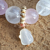 This natural crystal bracelet features a serene mix of white phantom quartz, soft rose quartz, and luminous citrine beads, creating a light, airy aesthetic. Adorned with delicate star-and-moon bodhi seed accents and a milky white chalcedony pendant, it adds a touch of gentle elegance to everyday wear.
