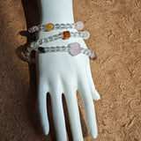 A multi-gemstone bracelet which is made with Silver Sheen Obsidian, Clear Quartz, Amethyst, Rose Quartz, Kyanite, Citrine, and Prehnite, etc. It’s also a necklace.