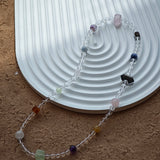 A multi-gemstone bracelet which is made with Silver Sheen Obsidian, Clear Quartz, Amethyst, Rose Quartz, Kyanite, Citrine, and Prehnite, etc. It’s also a necklace.