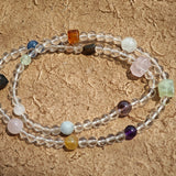 A multi-gemstone bracelet which is made with Silver Sheen Obsidian, Clear Quartz, Amethyst, Rose Quartz, Kyanite, Citrine, and Prehnite, etc. It’s also a necklace.