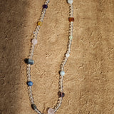 A multi-gemstone bracelet which is made with Silver Sheen Obsidian, Clear Quartz, Amethyst, Rose Quartz, Kyanite, Citrine, and Prehnite, etc. It’s also a necklace.