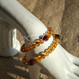 This is a layered bracelet consists of citrine beads, amethyst and aloeswood beads.