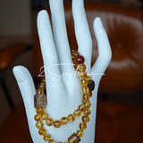 This is a layered bracelet consists of citrine beads, amethyst and aloeswood beads.
