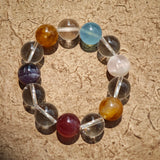 This exquisite piece features a curated blend of genuine crystals—from passionate Strawberry Quartz and tranquil Amethyst to the amplifying Clear Quartz—each selected for its unique beauty and energetic properties.