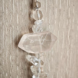 This handcrafted gemstone necklace is a stunning blend of natural crystals, featuring sparkling Herkimer Diamonds, vibrant Brazilian Amethyst, rich Pigeon's Blood Strawberry Quartz, serene Aquamarine, sunny Citrine, and luminous clear quartz, each bead hand-selected for its one-of-a-kind beauty. Strung alongside polished clear quartz spacers and accent stones, the necklace balances bold, colorful statement beads with delicate, shimmering crystal details, creating a piece that feels both earthy and ethereal.