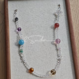 This handcrafted gemstone necklace is a stunning blend of natural crystals, featuring sparkling Herkimer Diamonds, vibrant Brazilian Amethyst, rich Pigeon's Blood Strawberry Quartz, serene Aquamarine, sunny Citrine, and luminous clear quartz, each bead hand-selected for its one-of-a-kind beauty. Strung alongside polished clear quartz spacers and accent stones, the necklace balances bold, colorful statement beads with delicate, shimmering crystal details, creating a piece that feels both earthy and ethereal.