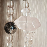 This handcrafted gemstone necklace is a stunning blend of natural crystals, featuring sparkling Herkimer Diamonds, vibrant Brazilian Amethyst, rich Pigeon's Blood Strawberry Quartz, serene Aquamarine, sunny Citrine, and luminous clear quartz, each bead hand-selected for its one-of-a-kind beauty. Strung alongside polished clear quartz spacers and accent stones, the necklace balances bold, colorful statement beads with delicate, shimmering crystal details, creating a piece that feels both earthy and ethereal.