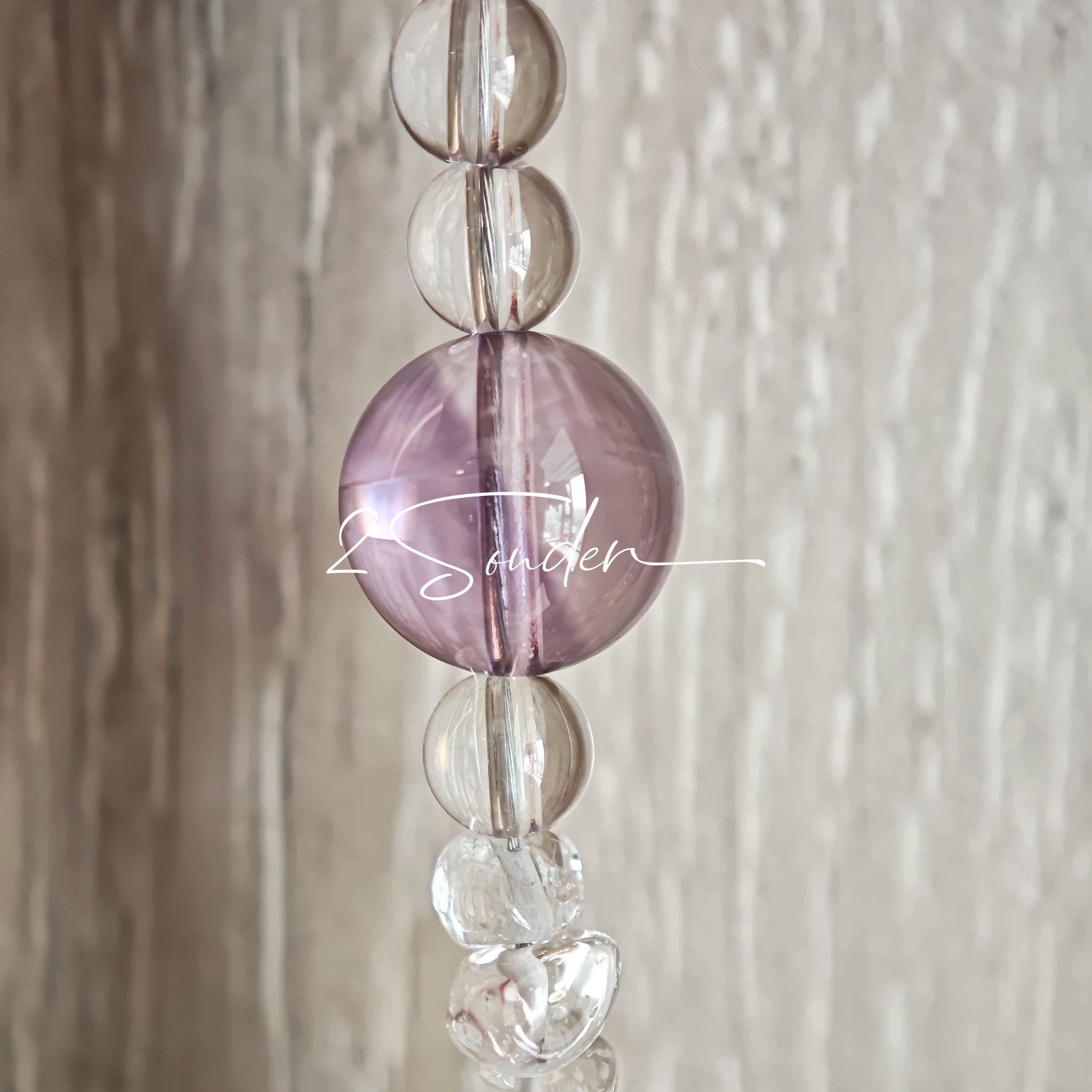 This handcrafted gemstone necklace is a stunning blend of natural crystals, featuring sparkling Herkimer Diamonds, vibrant Brazilian Amethyst, rich Pigeon's Blood Strawberry Quartz, serene Aquamarine, sunny Citrine, and luminous clear quartz, each bead hand-selected for its one-of-a-kind beauty. Strung alongside polished clear quartz spacers and accent stones, the necklace balances bold, colorful statement beads with delicate, shimmering crystal details, creating a piece that feels both earthy and ethereal.