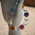 This exquisite piece features a curated blend of genuine crystals—from passionate Strawberry Quartz and tranquil Amethyst to the amplifying Clear Quartz—each selected for its unique beauty and energetic properties.