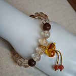 Wear solar threads, smell forest time, carry a carved amber bud that doubles as fortress and fortune cookie.