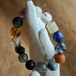 One neutral-friendly strand: rutilated quartz, white phantom, citrine, amethyst, moonstone and silver obsidian—mystery made simple.