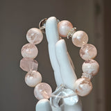 Wear a winter sunrise: phantom rose quartz for warmth, clear quartz for direction, both conspiring to unveil your truth.