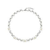 This delicate choker necklace features alternating polished metal butterflies and lustrous white mother-of-pearl butterflies, accented with tiny sparkling crystals. The shimmering white shell inlays contrast beautifully with the warm gold (or cool silver) metal finish, creating an elegant, whimsical design that sits close to the collarbone.