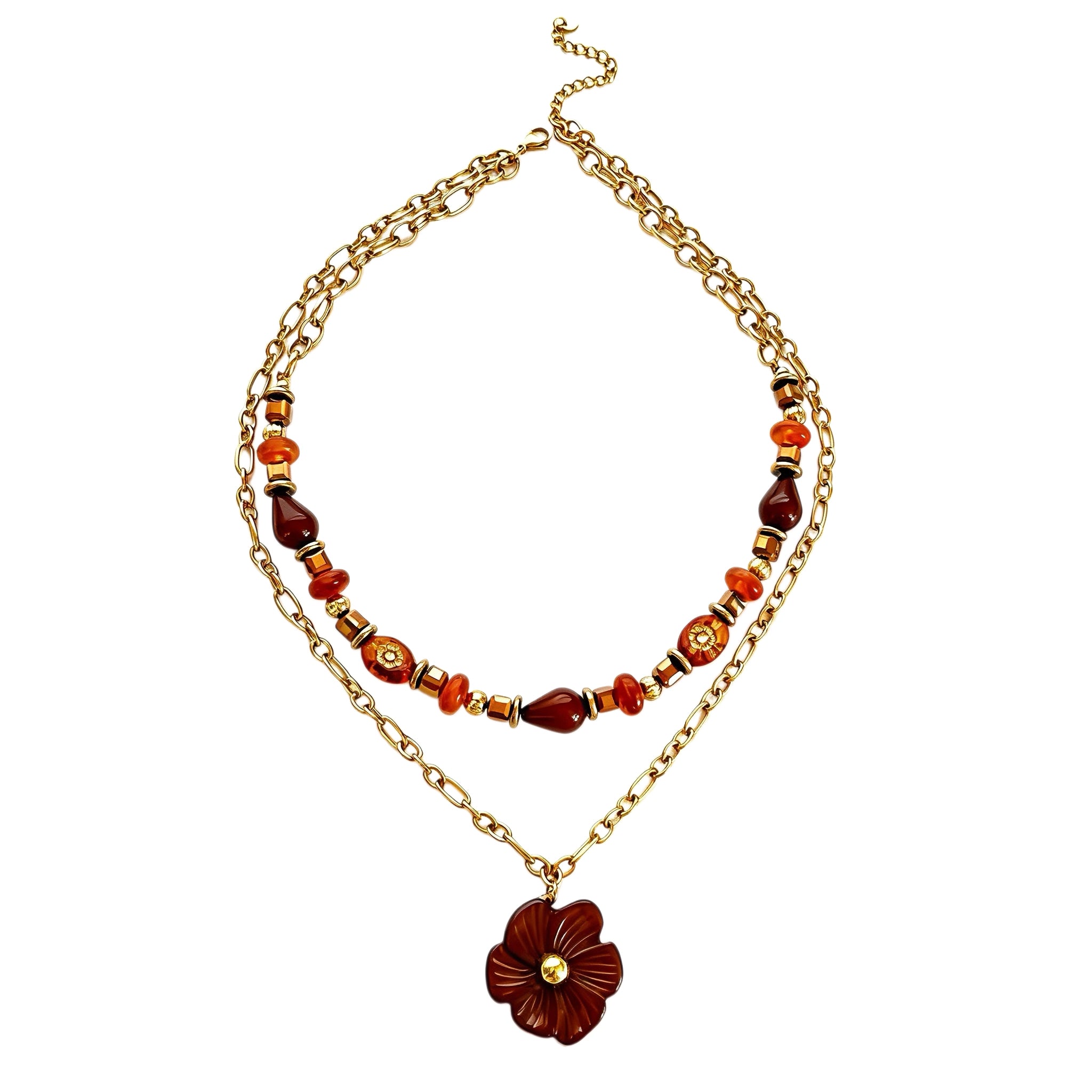 This vintage‑inspired Meidelat layered necklace features warm amber‑toned beads paired with polished gold‑toned metal chains. A carved rich brown flower pendant hangs on the lower paperclip chain, while the upper strand mixes varied-shaped resin beads for textured depth. Perfect for creating cozy boho‑chic layered neck stacking looks.