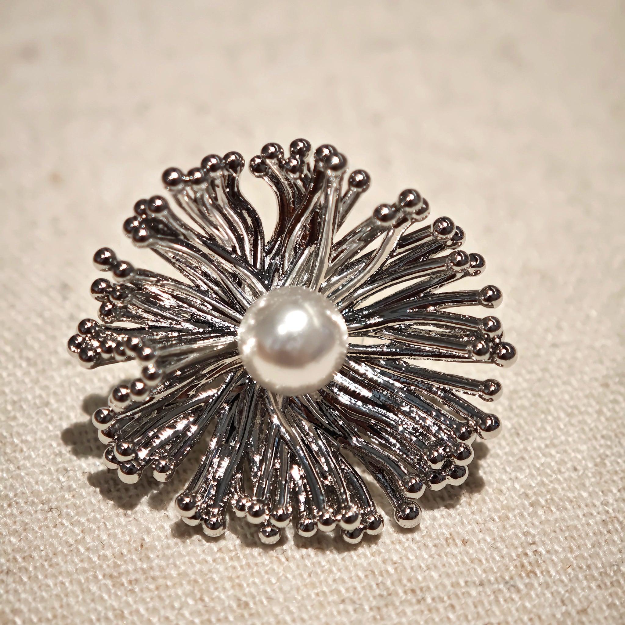These earrings perfectly blend delicate flowers with lustrous pearls, exuding timeless romance and adding an elegant touch to any outfit.