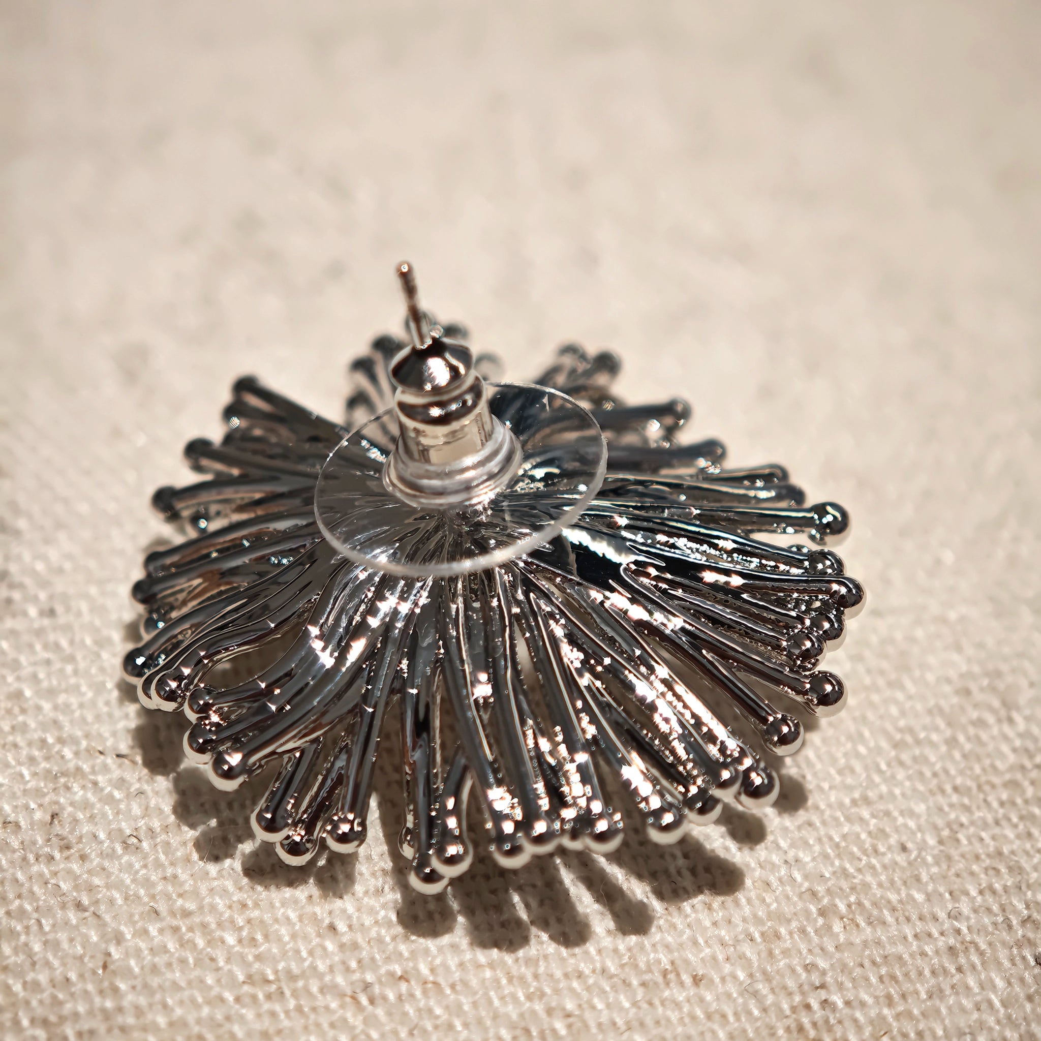 These earrings perfectly blend delicate flowers with lustrous pearls, exuding timeless romance and adding an elegant touch to any outfit.